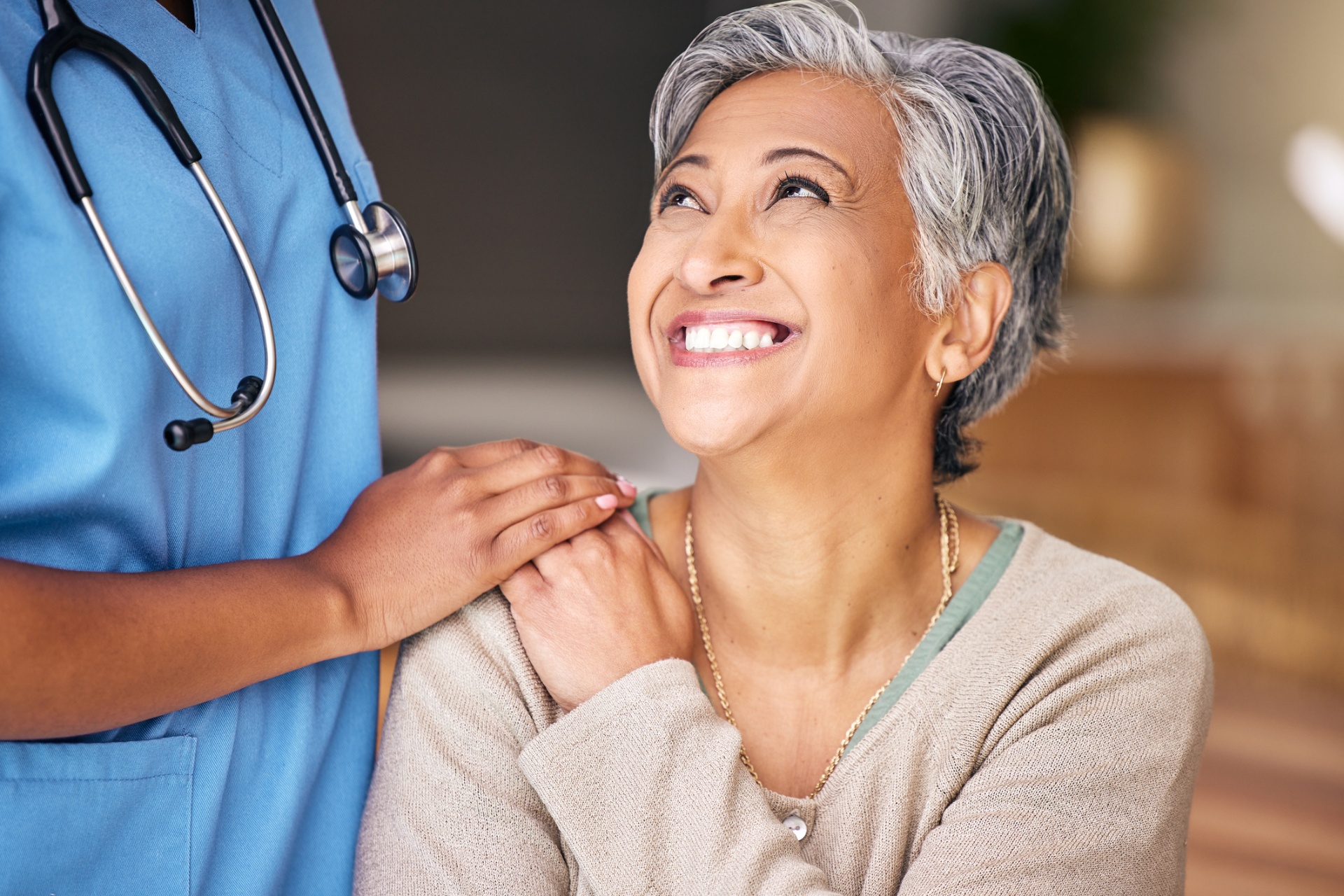 Smiling patient with her Vye provider during a caring consultation