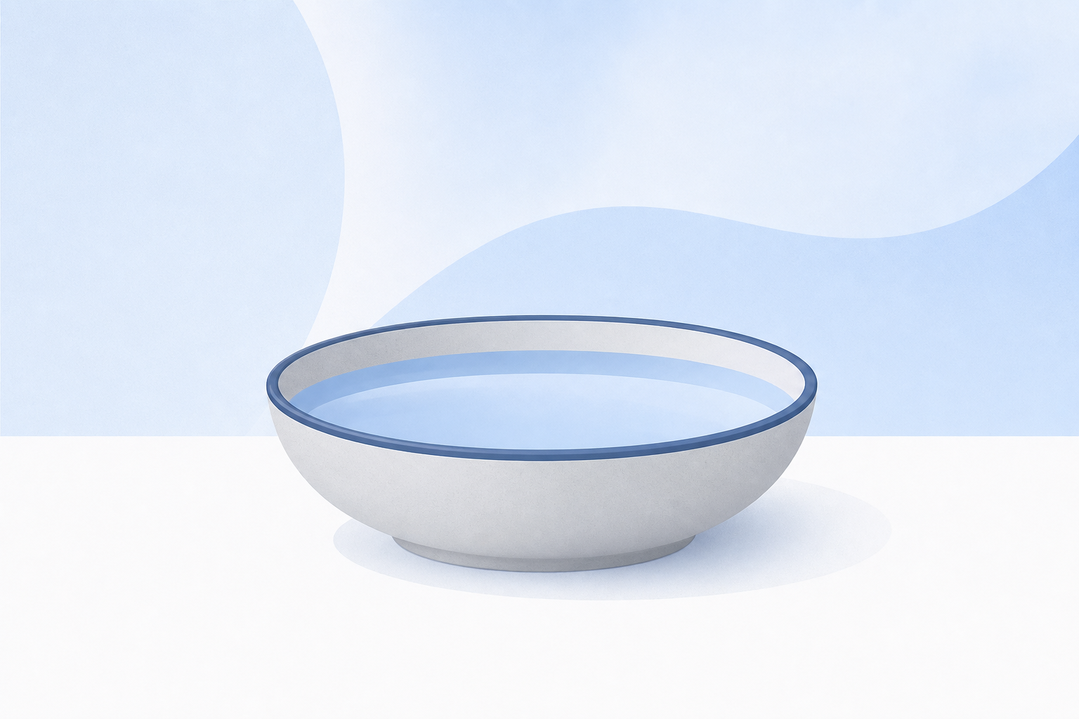 A shallow grey bowl with a blue rim, holding still pale blue water.