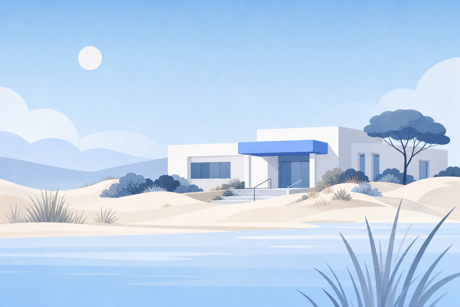 A low white clinic with a blue awning beside soft dunes and calm coastal water